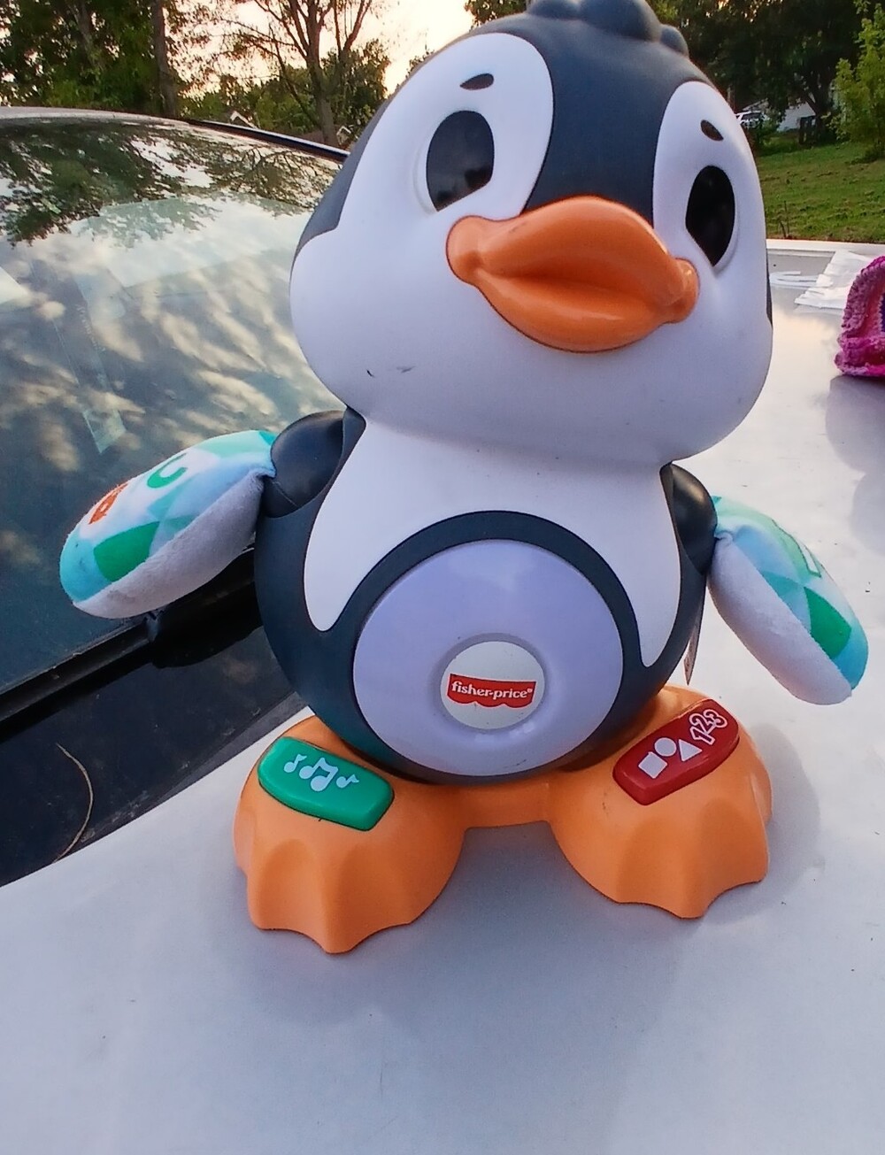 Fisher-Price Musical Penguin Plush Toy - Black, White, Orange, Green, Teal